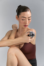 Seated model using Cavi Spa RF Core Plus on her arm
