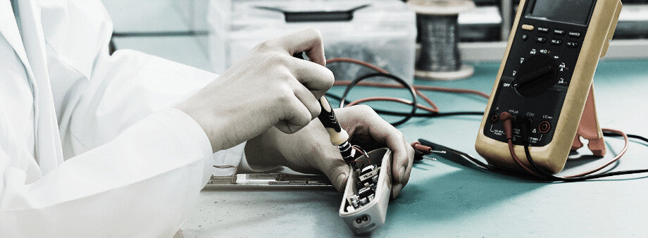 YA-MAN engineer testing a device in the lab
