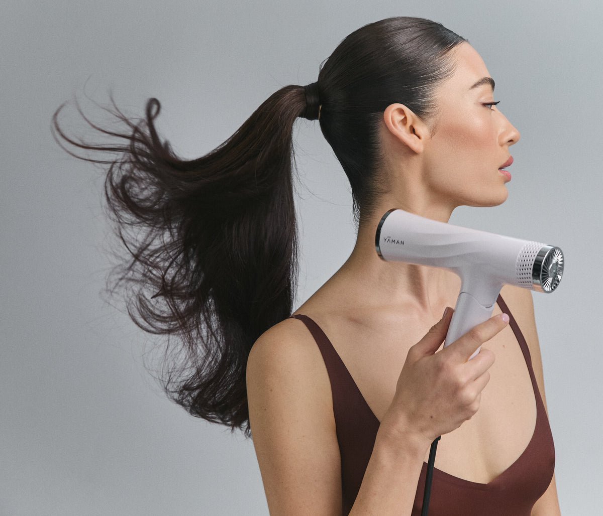 Lift Dryer Smart blowing a ponytail, profile view