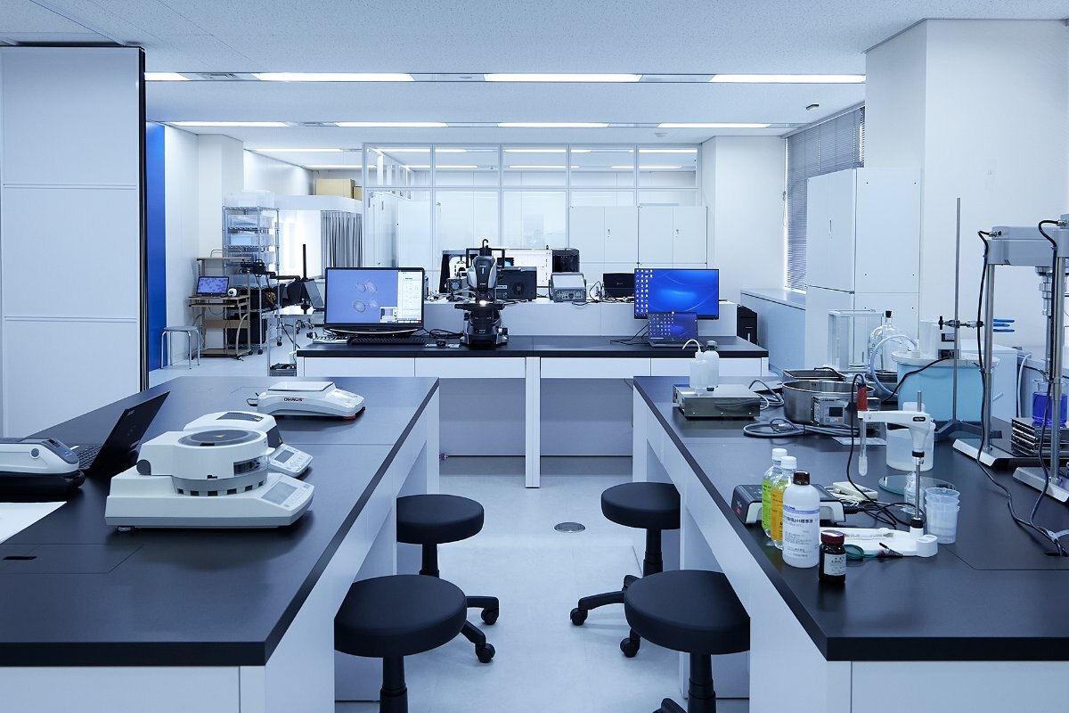 Laboratory room at YA-MAN with benches and instruments